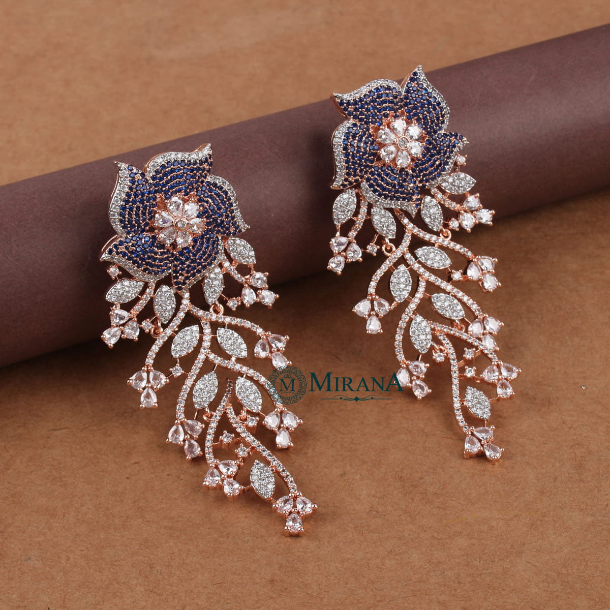MJER21E318-2-Ira-Flower-Colored-Earrings-Rose-Gold-Blue-Colored-Look-7.jpg